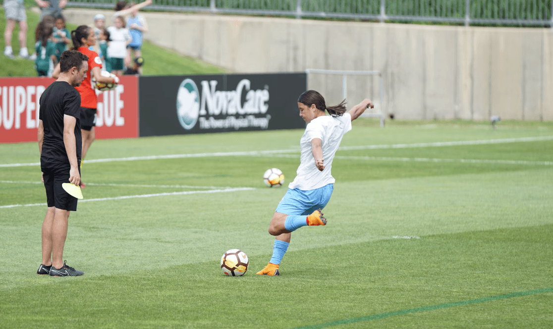 soccer player kicking a ball