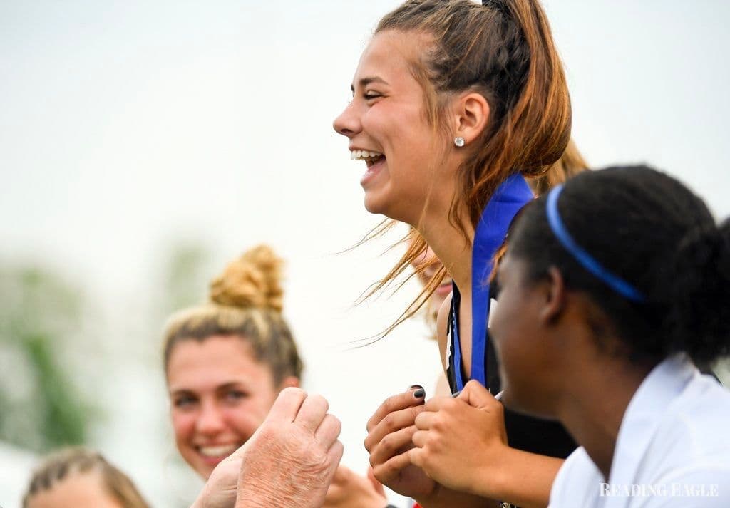 teenager getting a medal